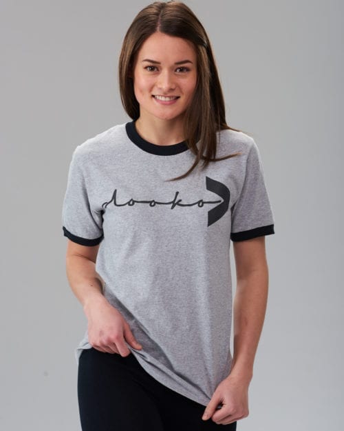 female model wearing the gray ringer t-shirt with the dooko logo covering the chest