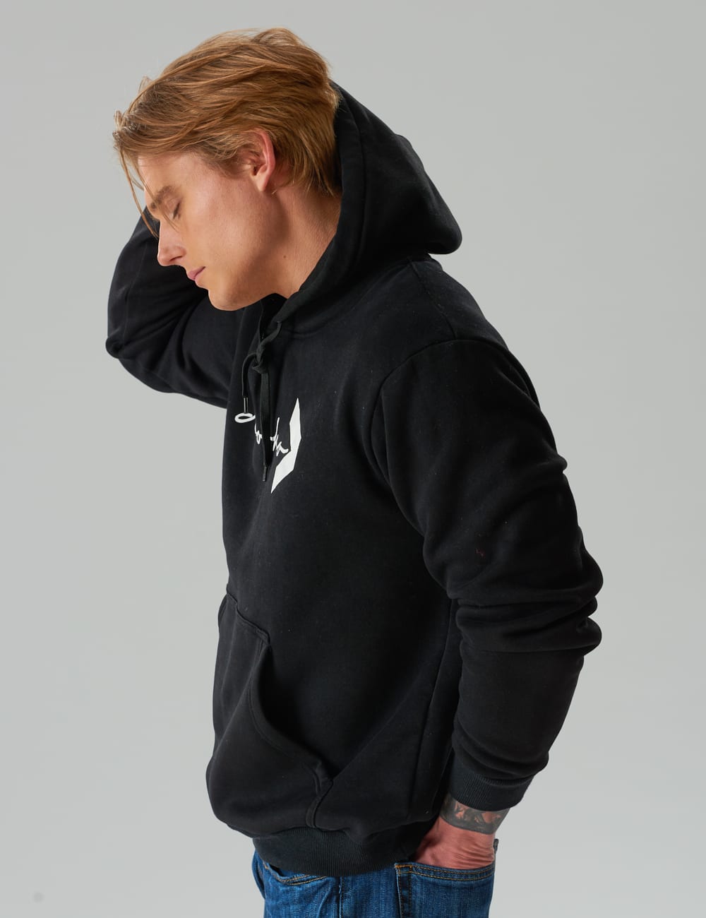 model wearing a black dooko hooded sweatshirt by dooko