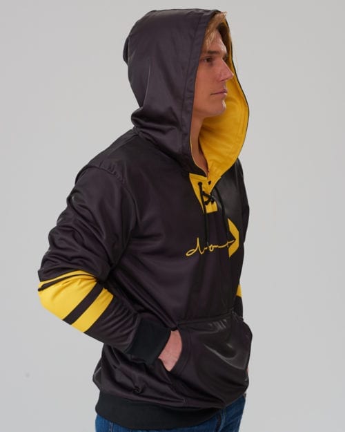 model wearing a black lace-up hoodie with yellow stripes