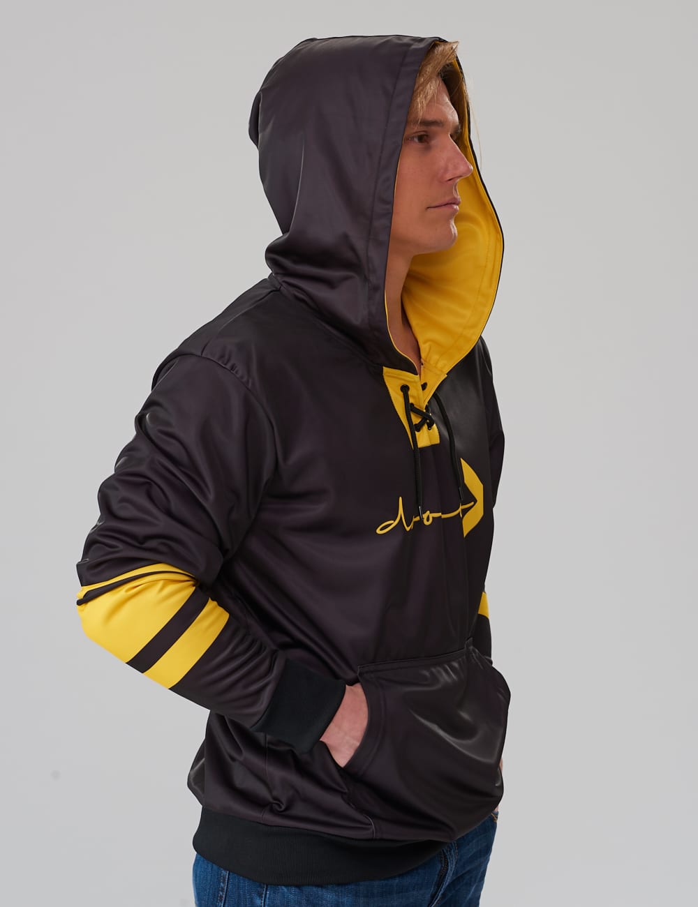 model wearing a black lace-up hoodie with yellow stripes