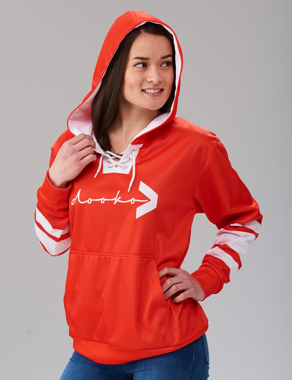 female model wearing an orange lace-up hoodie with white stripes